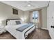 Cozy bedroom with ceiling fan, large window, and closet providing ample storage space at 5435 E Cambridge Ave, Phoenix, AZ 85008