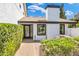 Charming front entry with a decorative wreath, a brick walkway and professionally designed landscaping at 5435 E Cambridge Ave, Phoenix, AZ 85008