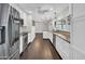 Modern kitchen featuring stainless steel appliances, granite countertops, and wood flooring at 5435 E Cambridge Ave, Phoenix, AZ 85008