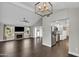 Open-concept living area featuring a fireplace, sleek tile floors, and seamless kitchen access at 5435 E Cambridge Ave, Phoenix, AZ 85008