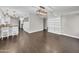 Bright living room features modern lighting, wood floors, and breakfast bar with seating at 5435 E Cambridge Ave, Phoenix, AZ 85008