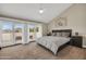 Spacious main bedroom with vaulted ceilings and private balcony access at 5435 E Cambridge Ave, Phoenix, AZ 85008