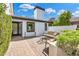 Cozy outdoor patio with comfortable seating, privacy landscaping and brick pavers, perfect for relaxation at 5435 E Cambridge Ave, Phoenix, AZ 85008