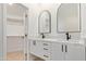 Modern bathroom with double vanity, marble countertops, and black hardware at 5909 E Aire Libre Ln, Scottsdale, AZ 85254