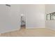 Spacious bedroom with light hardwood floors and ensuite bathroom at 5909 E Aire Libre Ln, Scottsdale, AZ 85254