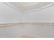 Walk-in closet with white shelving and light hardwood floors at 5909 E Aire Libre Ln, Scottsdale, AZ 85254