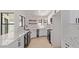 Bright modern kitchen with white cabinets, stainless steel appliances, and light countertops at 5909 E Aire Libre Ln, Scottsdale, AZ 85254