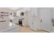 Modern kitchen with white cabinets, stainless steel appliances, and light countertops at 5909 E Aire Libre Ln, Scottsdale, AZ 85254