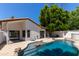 Sparkling pool surrounded by lush greenery, offering a refreshing oasis at 5909 E Aire Libre Ln, Scottsdale, AZ 85254