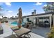 Inviting backyard with a swimming pool, patio, and outdoor dining area, perfect for entertaining at 6550 W Wolf St, Phoenix, AZ 85033