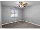 Comfortable bedroom with a window providing natural light and neutral-toned walls at 6550 W Wolf St, Phoenix, AZ 85033