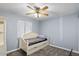 Cozy bedroom with a ceiling fan and a comfortable daybed, perfect for relaxing at 6550 W Wolf St, Phoenix, AZ 85033