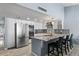 Well-equipped kitchen with stainless steel appliances and granite countertops and tile floors at 6550 W Wolf St, Phoenix, AZ 85033