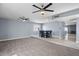 Inviting living room flows into dining area with stylish, gray accent wall and recessed lighting at 6550 W Wolf St, Phoenix, AZ 85033
