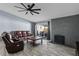 Comfortable living room featuring a brick fireplace and access to the patio at 6550 W Wolf St, Phoenix, AZ 85033