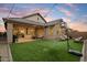 Backyard with turf and basketball hoop, perfect for outdoor entertaining at 6954 W Maya Way, Peoria, AZ 85383