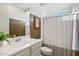 Stylish bathroom with a vanity, framed mirror, and combination shower and tub at 6954 W Maya Way, Peoria, AZ 85383