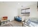 bedroom with two twin beds, neutral colors, and playful decor at 6954 W Maya Way, Peoria, AZ 85383