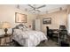 Bedroom with a desk, ceiling fan, and neutral paint, and featuring artwork at 7400 E Gainey Club Dr # 203, Scottsdale, AZ 85258