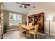 Cozy dining area featuring a large built-in bookcase, enhancing the room's character and functionality at 7400 E Gainey Club Dr # 203, Scottsdale, AZ 85258