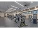 Well-equipped gym with modern weight machines, ceiling fans, and ample natural light through the windows at 7400 E Gainey Club Dr # 203, Scottsdale, AZ 85258