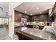 A lovely kitchen is equipped with wooden cabinets, stainless steel appliances, and a breakfast bar at 7400 E Gainey Club Dr # 203, Scottsdale, AZ 85258