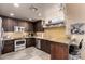 This is a well-equipped kitchen featuring wooden cabinets, stainless steel appliances, and ample countertop space at 7400 E Gainey Club Dr # 203, Scottsdale, AZ 85258