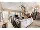 Cozy living space with a stone fireplace, high ceilings, and stylish decor at 7400 E Gainey Club Dr # 203, Scottsdale, AZ 85258