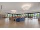 Spacious lounge area with contemporary seating, large windows, and stylish light fixtures at 7400 E Gainey Club Dr # 203, Scottsdale, AZ 85258