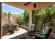 A comfortable patio area with ceiling fan and a relaxing outdoor furniture set at 7400 E Gainey Club Dr # 203, Scottsdale, AZ 85258