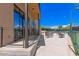 View of outdoor tennis courts with a patio featuring tables and seating for relaxation and socializing at 7400 E Gainey Club Dr # 203, Scottsdale, AZ 85258