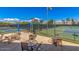 Overhead view of tennis courts with shaded seating areas and a well-maintained facility at 7400 E Gainey Club Dr # 203, Scottsdale, AZ 85258
