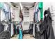 Spacious walk-in closet with organized shelving, hanging racks, and ample storage for clothing at 7400 E Gainey Club Dr # 203, Scottsdale, AZ 85258