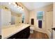 Bathroom featuring a dark wood vanity with a white countertop and a shower/tub combo at 7658 W Boca Raton Rd, Peoria, AZ 85381