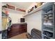 Walk-in closet with built-in shelving and ample storage for shoes, clothes, and accessories at 7658 W Boca Raton Rd, Peoria, AZ 85381