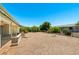 Backyard with desert landscaping, a patio, and a covered seating area at 839 Leisure World --, Mesa, AZ 85206