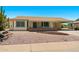 Charming single-story home featuring a desert landscape, covered entryway, and a carport on a sunny day at 839 Leisure World --, Mesa, AZ 85206