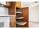 A kitchen featuring light cabinets with pull-out shelves and a white range at 839 Leisure World --, Mesa, AZ 85206