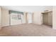 Spacious living room with neutral carpet, a window for natural light, and easy access to other parts of the home at 839 Leisure World --, Mesa, AZ 85206