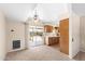 Open-concept living space featuring sliding glass doors to patio and a view of the kitchen, fostering a cohesive feel at 839 Leisure World --, Mesa, AZ 85206