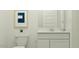 Clean bathroom featuring a toilet, vanity, and minimal decor for a modern look at 9541 W Pinchot Ave, Phoenix, AZ 85037