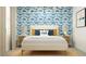 Cheerful bedroom featuring bed, playful dinosaur wallpaper, and coordinating furniture for a vibrant space at 9541 W Pinchot Ave, Phoenix, AZ 85037