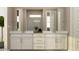 Bathroom featuring dual sinks, elegant countertops, and modern fixtures, offering style and functionality at 9633 W Monterey Way, Phoenix, AZ 85037
