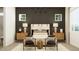 Well-lit bedroom with a modern bed, stylish furniture, and contemporary decor, creating a serene atmosphere at 9633 W Monterey Way, Phoenix, AZ 85037