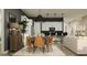 Inviting dining room featuring a modern table, stylish chairs, and an open-concept layout to the kitchen at 9633 W Monterey Way, Phoenix, AZ 85037