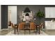 An expansive dining area showcases a large table, contemporary chairs, and elegant decor with a gray wall at 9633 W Monterey Way, Phoenix, AZ 85037