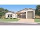 Charming single-story home with a tile roof, neutral stucco, and a two-car garage at 9633 W Monterey Way, Phoenix, AZ 85037