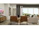 View of a cozy living room with modern furnishings and warm, neutral colors at 9633 W Monterey Way, Phoenix, AZ 85037