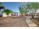 Private backyard featuring easy desert landscaping and a covered outdoor seating area at 1512 E Cypress St, Phoenix, AZ 85006