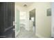 Bright entryway featuring tile flooring, a glass-door pantry, and open view to kitchen at 1512 E Cypress St, Phoenix, AZ 85006
